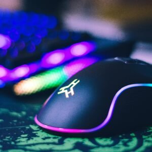 A close-up of a colorful gaming mouse and illuminated RGB keyboard, perfect for tech setups.